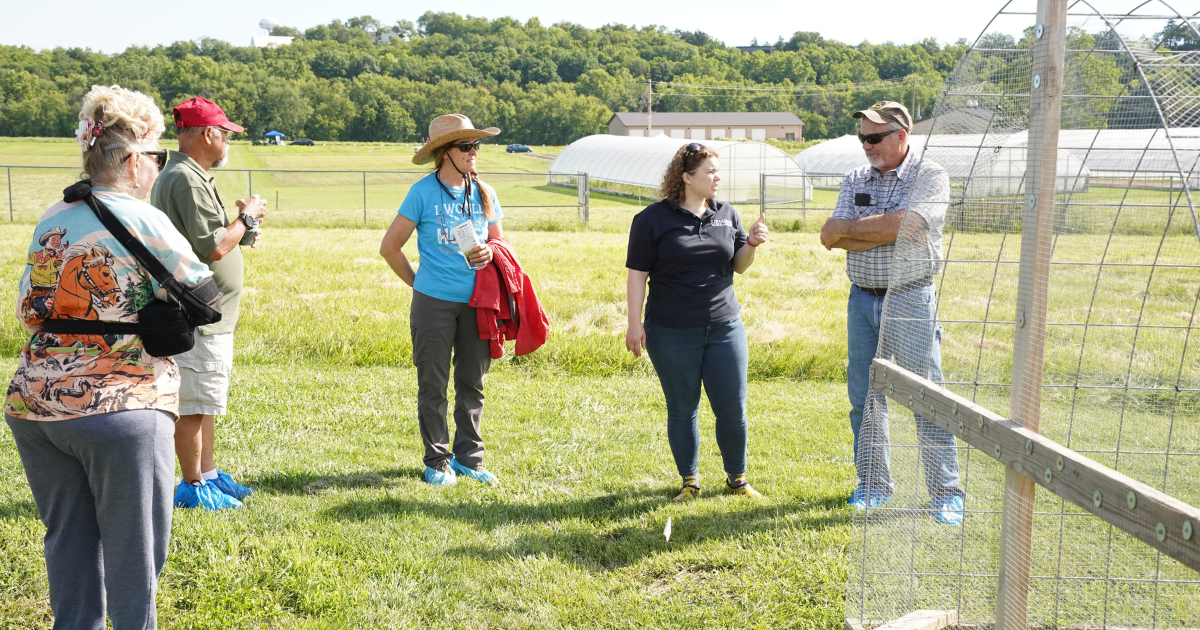 Attendees, Lester and Pam Mason, speak with Poultry Extension State Specialist Tatijana Fisher, Ph.D., about chicken keeping, proper nutrition and management at the recent Carver Farm Field Day.