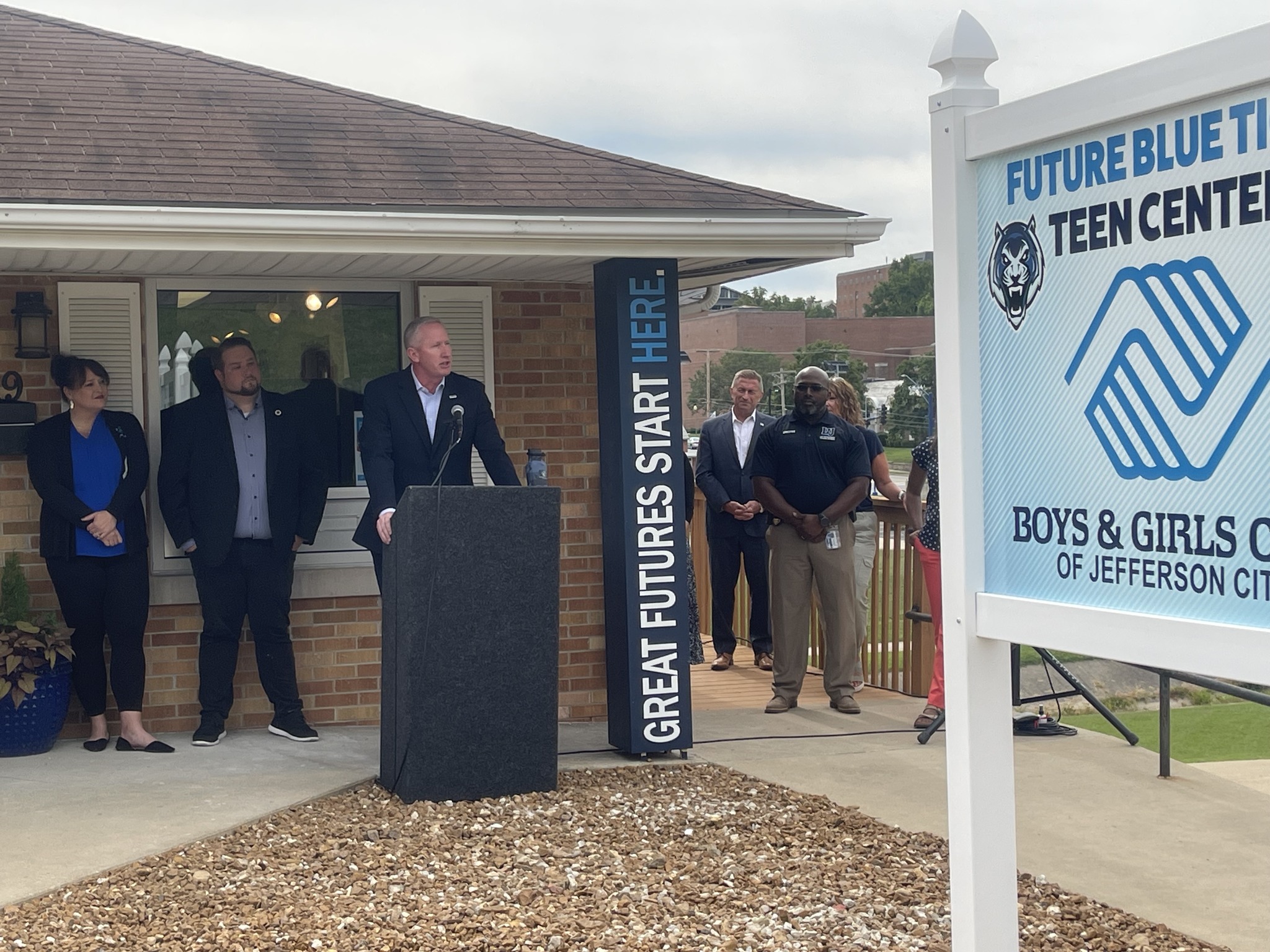 President Moseley speaks at the teen center ribbon-cutting ceremony.