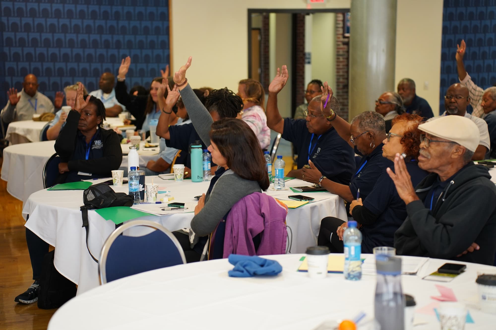 Trainers respond to questions during a workshop.