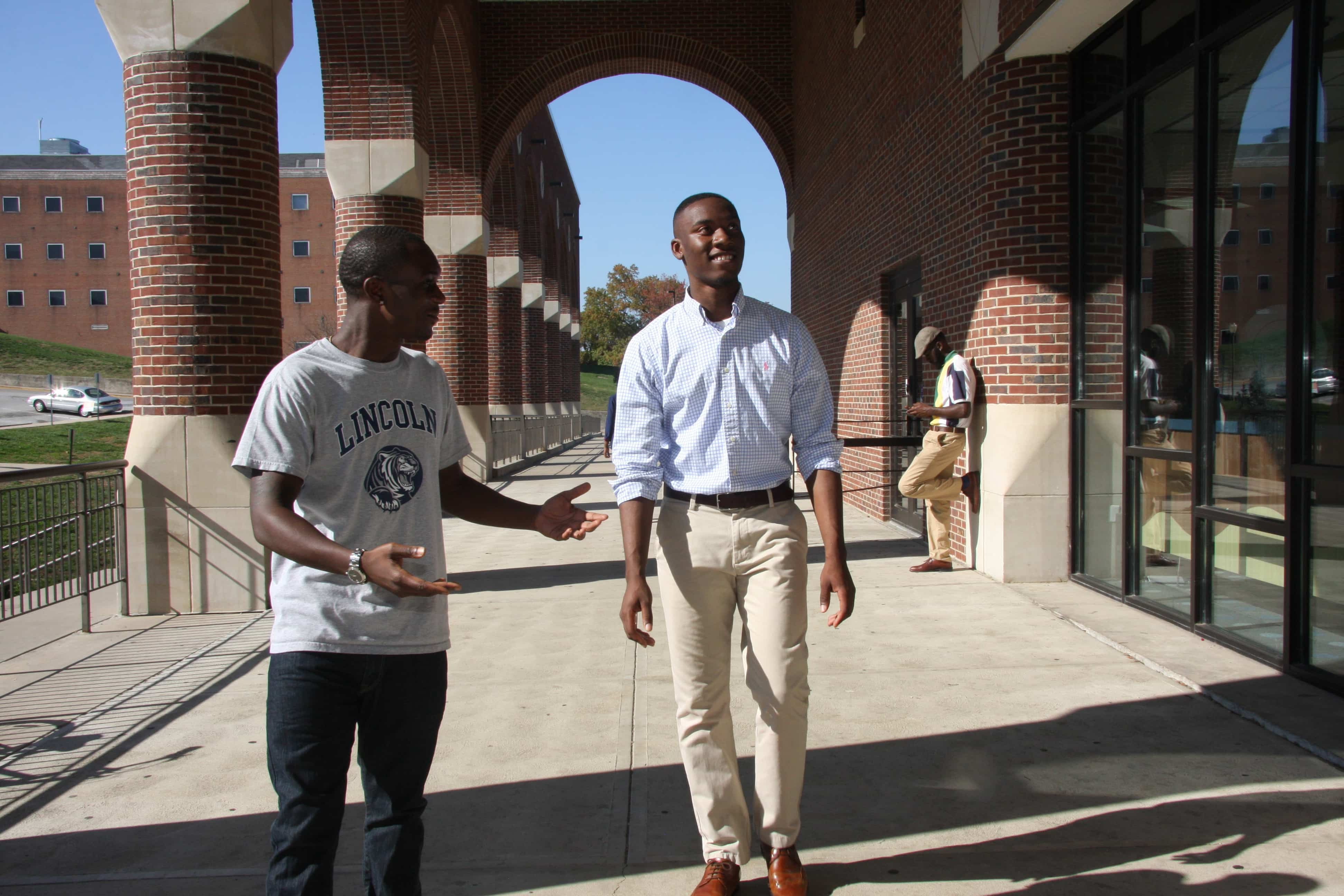 Students walking on campus by Page Library