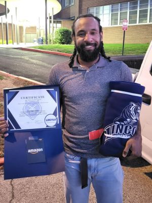 Eugene Diggs II receiving LU employee of the month award