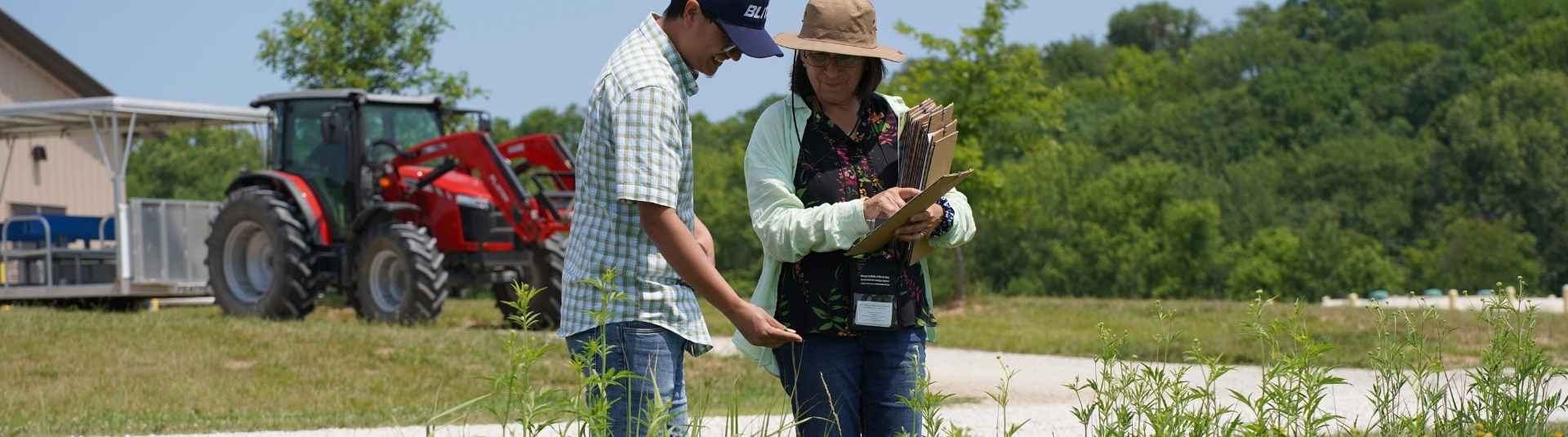 Lincoln University College of Agriculture professors examine a field of wildflowers