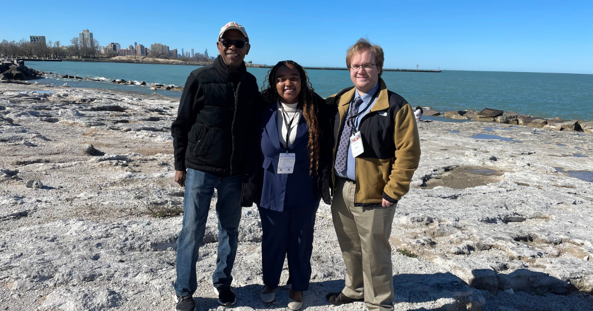 Lionel Harris, the Lincoln University Chicago alumni chapter president, welcomes students Nia Walker and Jackson Black to the shores of Lake Michigan.