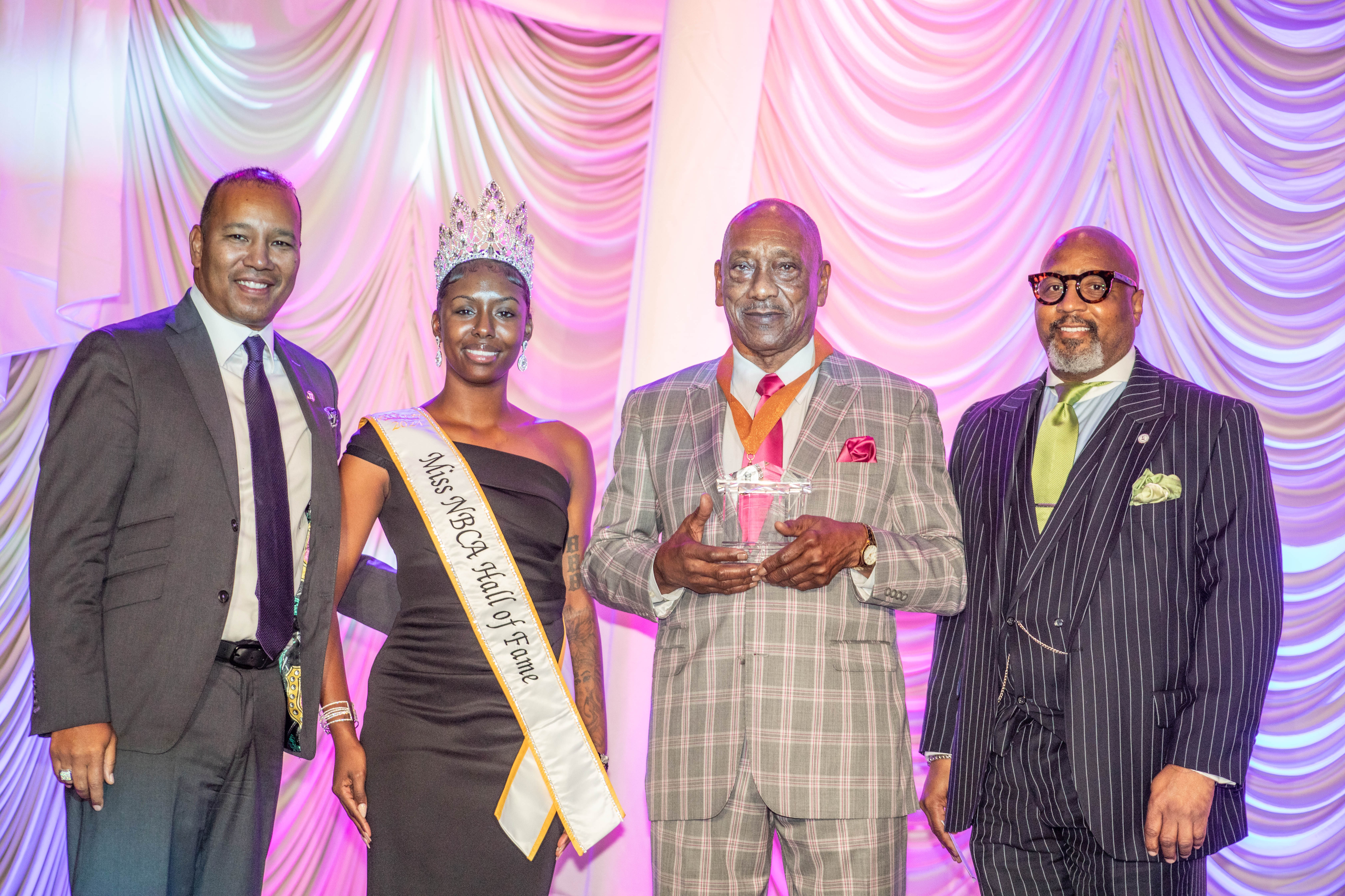 Lemar Parrish was inducted into the National Black College Alumni Hall of Fame on September 28, 2024. Pictured from left to right: National Black College Alumni Hall of Fame (NBCA HOF) Foundation Chairman Mr. Quentin Roach, Miss NBCA HOF, Mr. Lemar Parrish and Dr. Grant Winrow, Lincoln University vice president for university advancement.