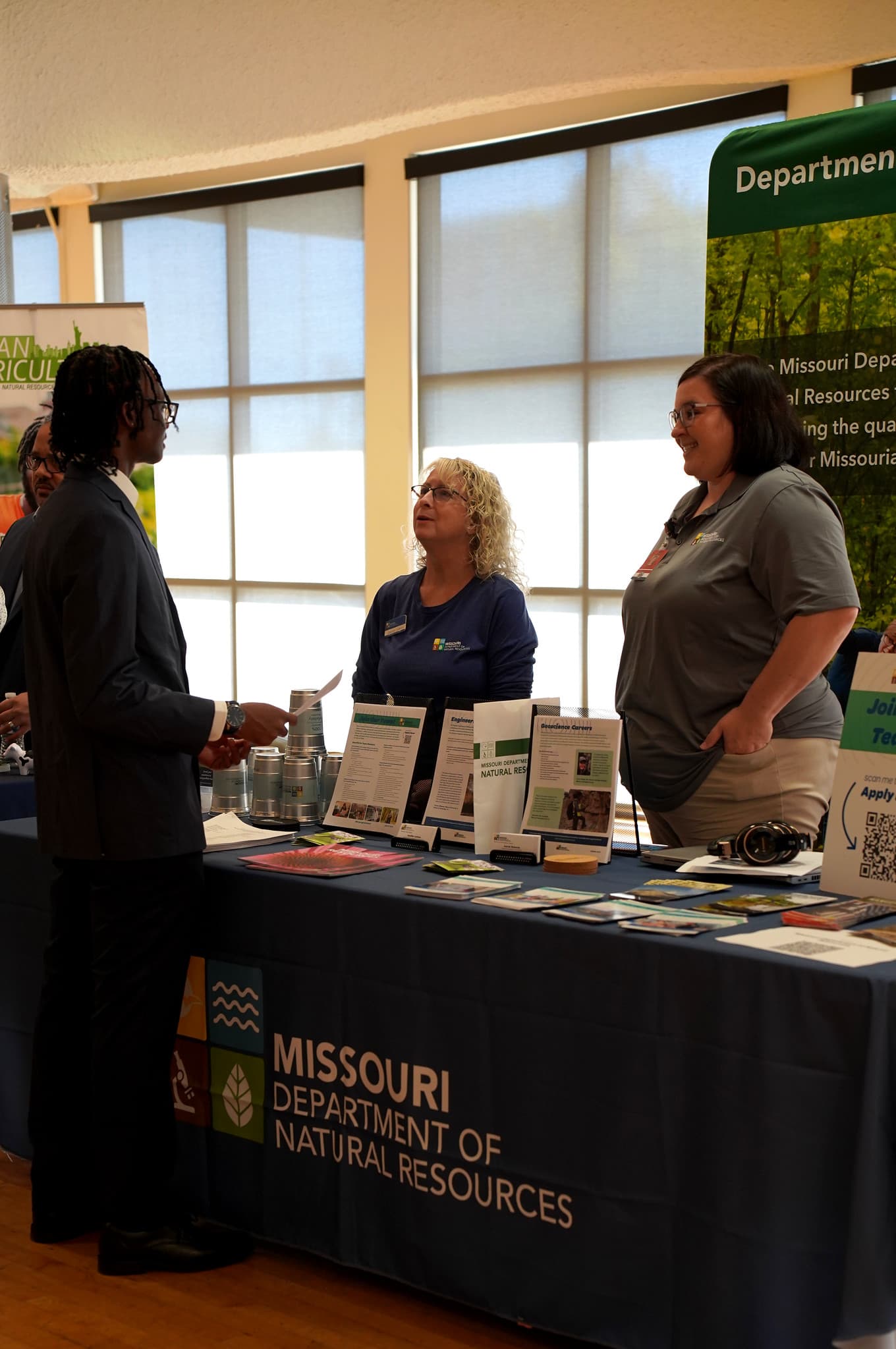 A student stops by the Missouri Department of Natural Resources booth at the LU Career Fair to explore opportunities in conservation and environmental stewardship.