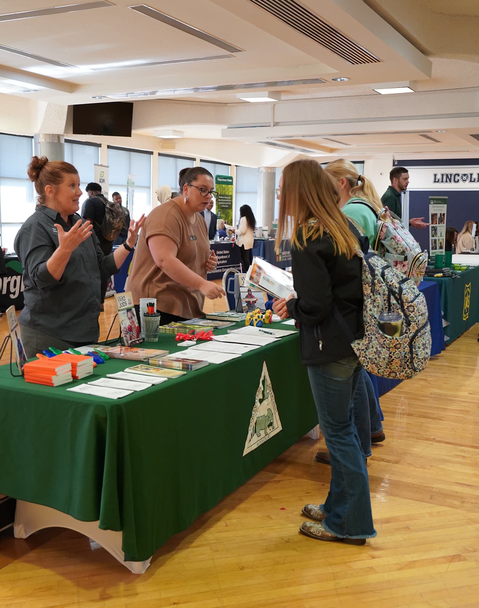 The Missouri Department of Conservation engages with students at the LU Career Fair, showcasing career opportunities in wildlife management and conservation.