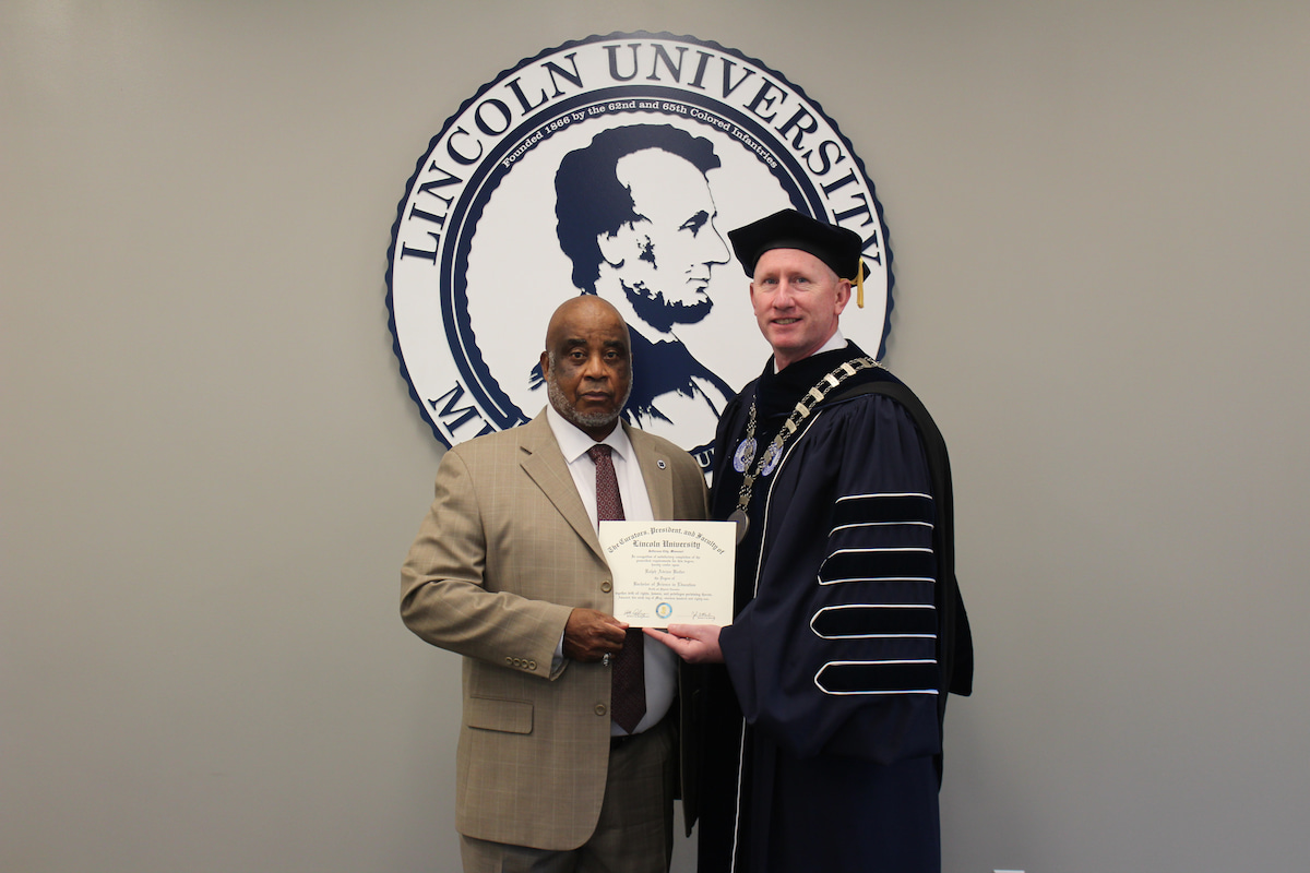 Col. Ralph Butler receives his long-awaited diploma from Lincoln University President Dr. John Moseley on October 3, 2024. 