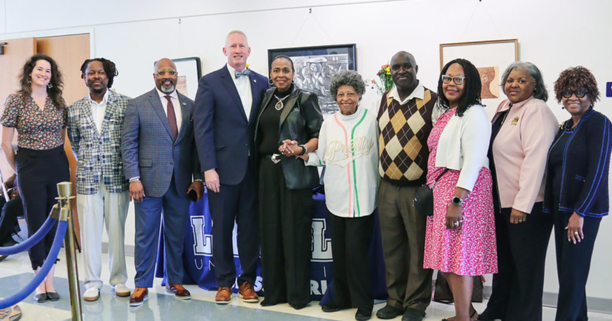 Lincoln University of Missouri alumna Florene Calvin Dawkins donated original artwork and rare books to the university during a special ceremony on Oct. 4 in Memorial Hall.  Pictured three from the left: Vice President for University Advancement Dr. Grant Winrow, LU President Dr. John B. Moseley and LU alumna Florene Calvin Dawkins.