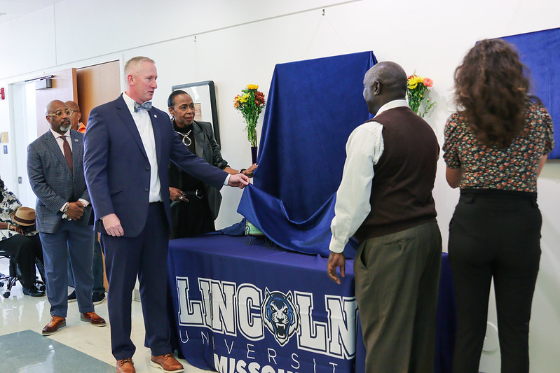 President Moseley and Florene Calvin Dawkins unveil covered art