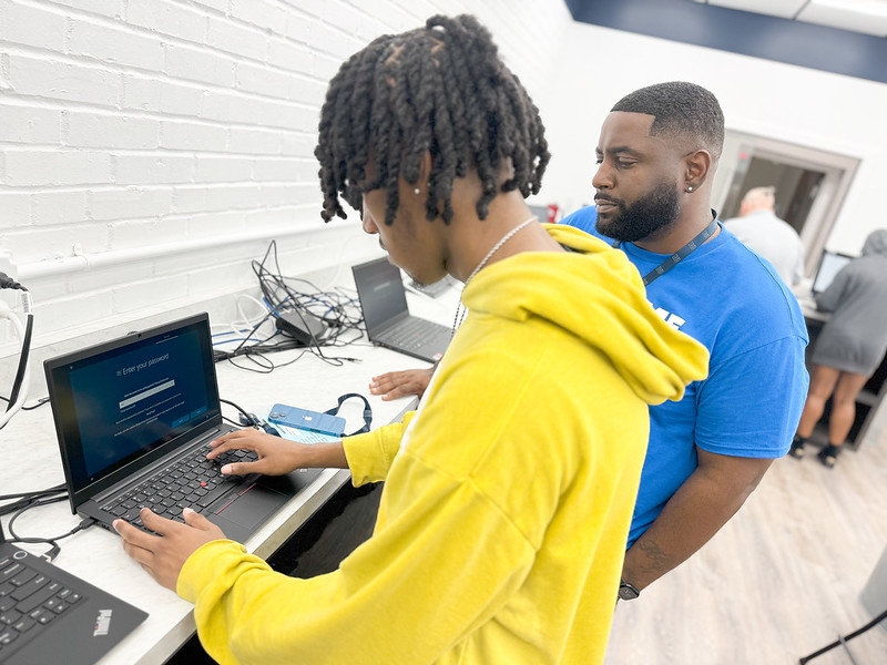 Student getting access to laptop as part of the Blue Tiger Connect program