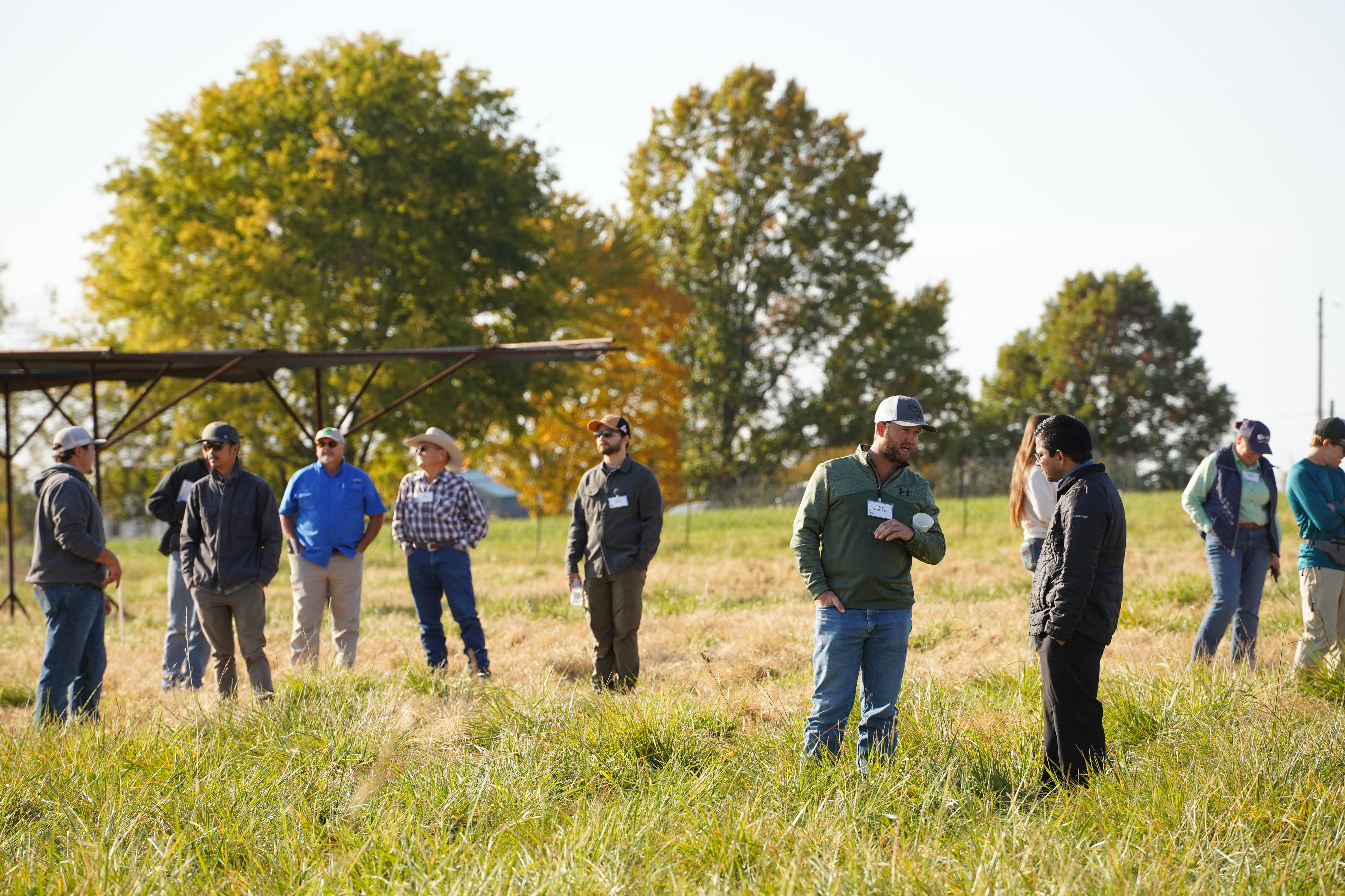 Private producers and Lincoln University staff and faculty connect between sessions at the grazing training, sharing insights and experiences on regenerative grazing practices.