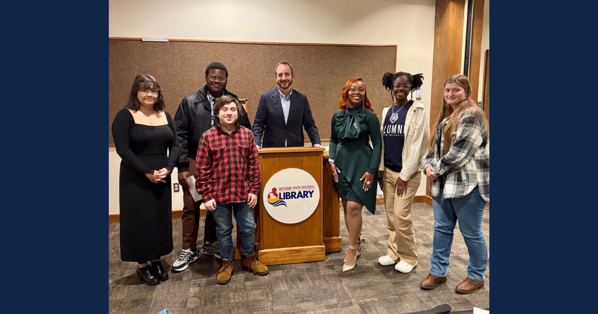 Undergraduate Poetry Workshop students presented their original work during an Evening of Poetry at the Missouri River Regional Library on December 3. Left to right; Cassandra Hile, Malachi Holliman, Parrish Morris, Professor Elijah Burrell, Yessnia Austin-Dixon, Kennedy Thompson and Cheyene Koetting.