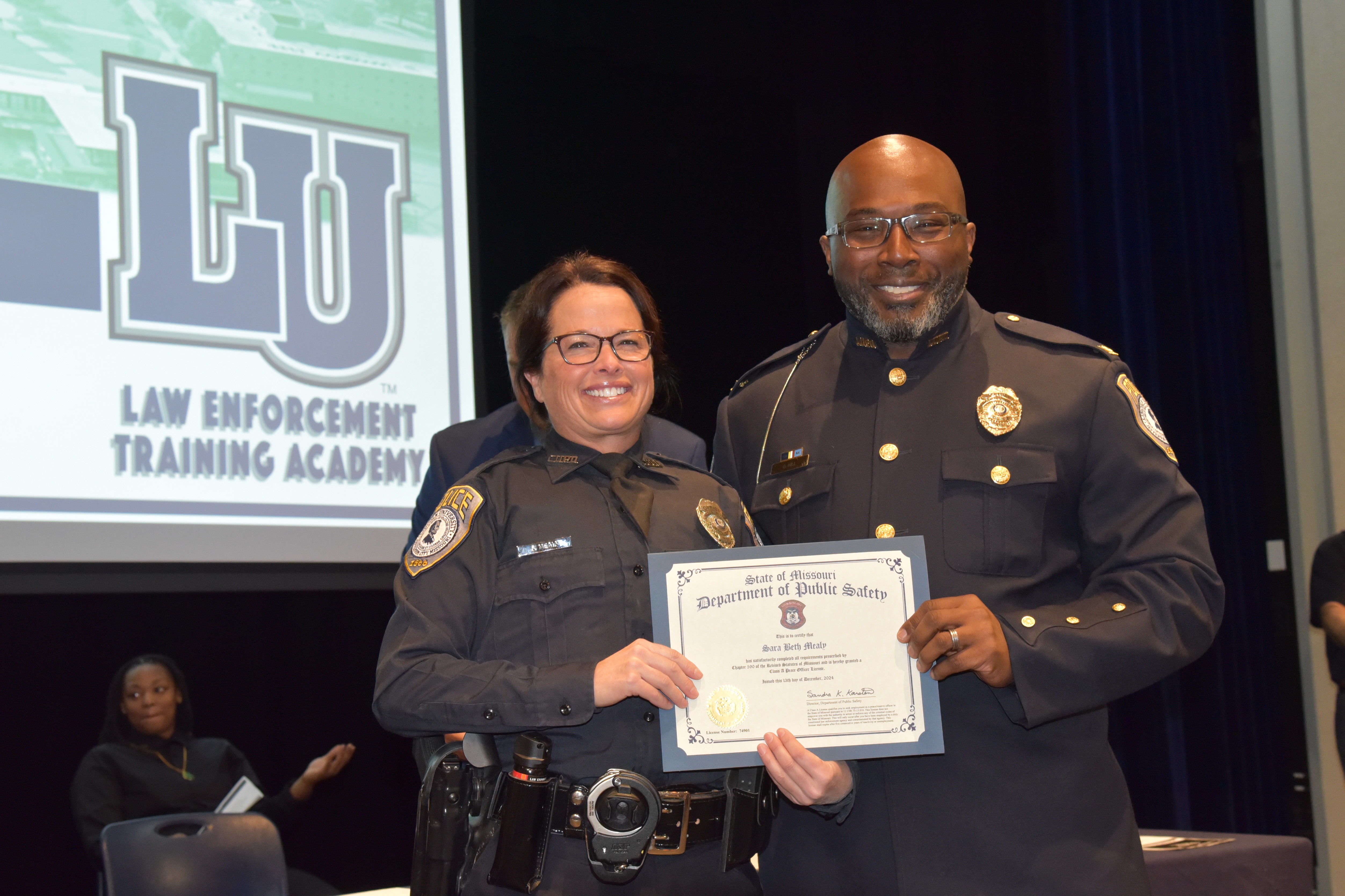 Lincoln University of Missouri Law Enforcement Training Academy LULETA graduate Sara Mealy and Chief Gary Hill. 